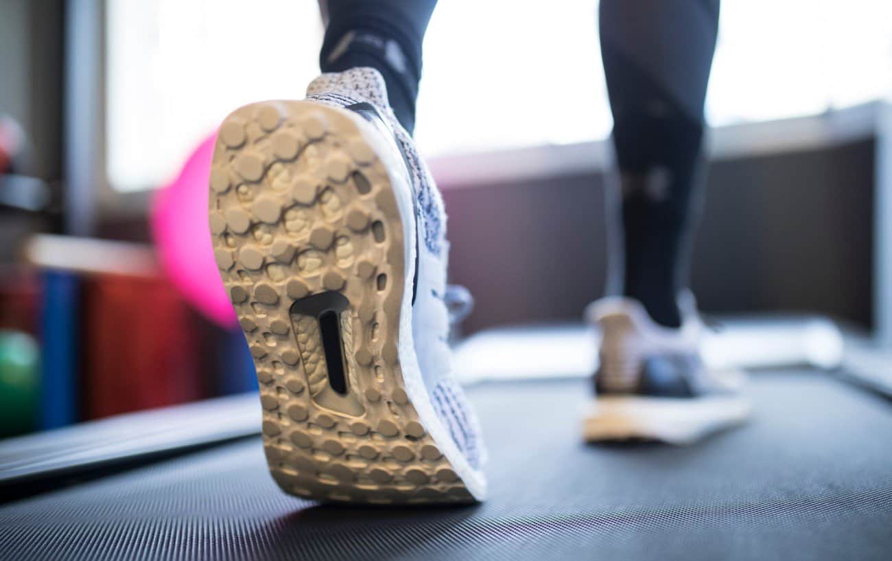 Woman's feet on a treadmill.