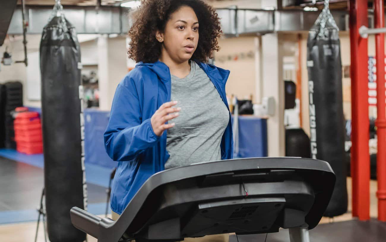 Woman running on a treadmill.