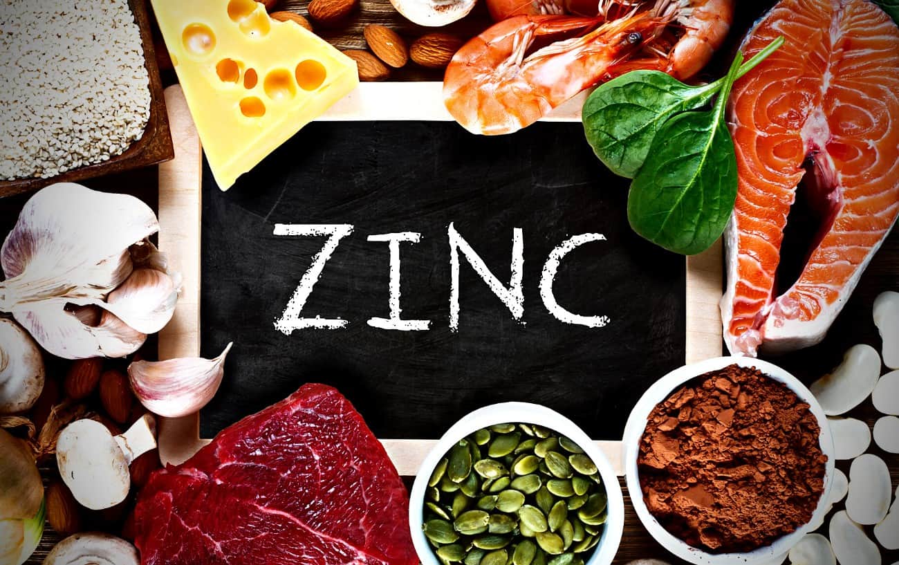 A sign that says "zinc", fish, cheese, garlic, meat and beans.