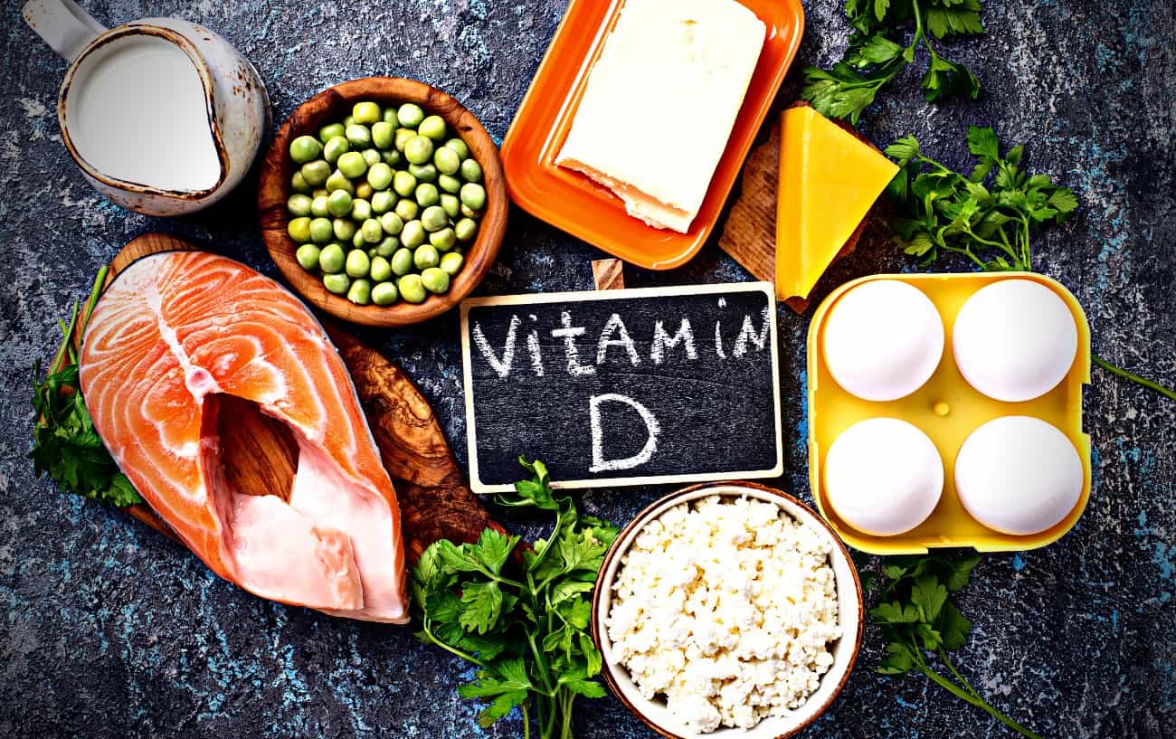 A sign that says "vitamin d", eggs, cheese, fish, and milk. 