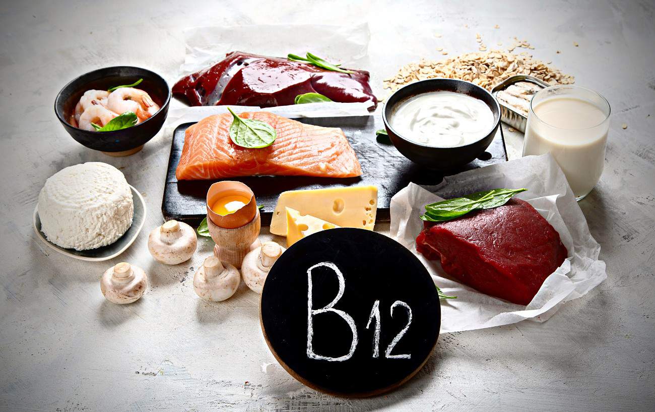 A sign that says "B12", milk, cheese, mushrooms, meat, fish and eggs.