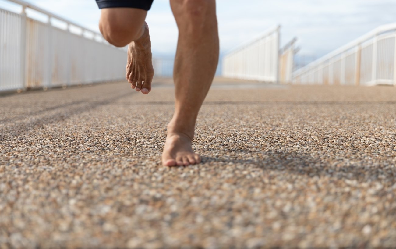 Man Running Barefoot