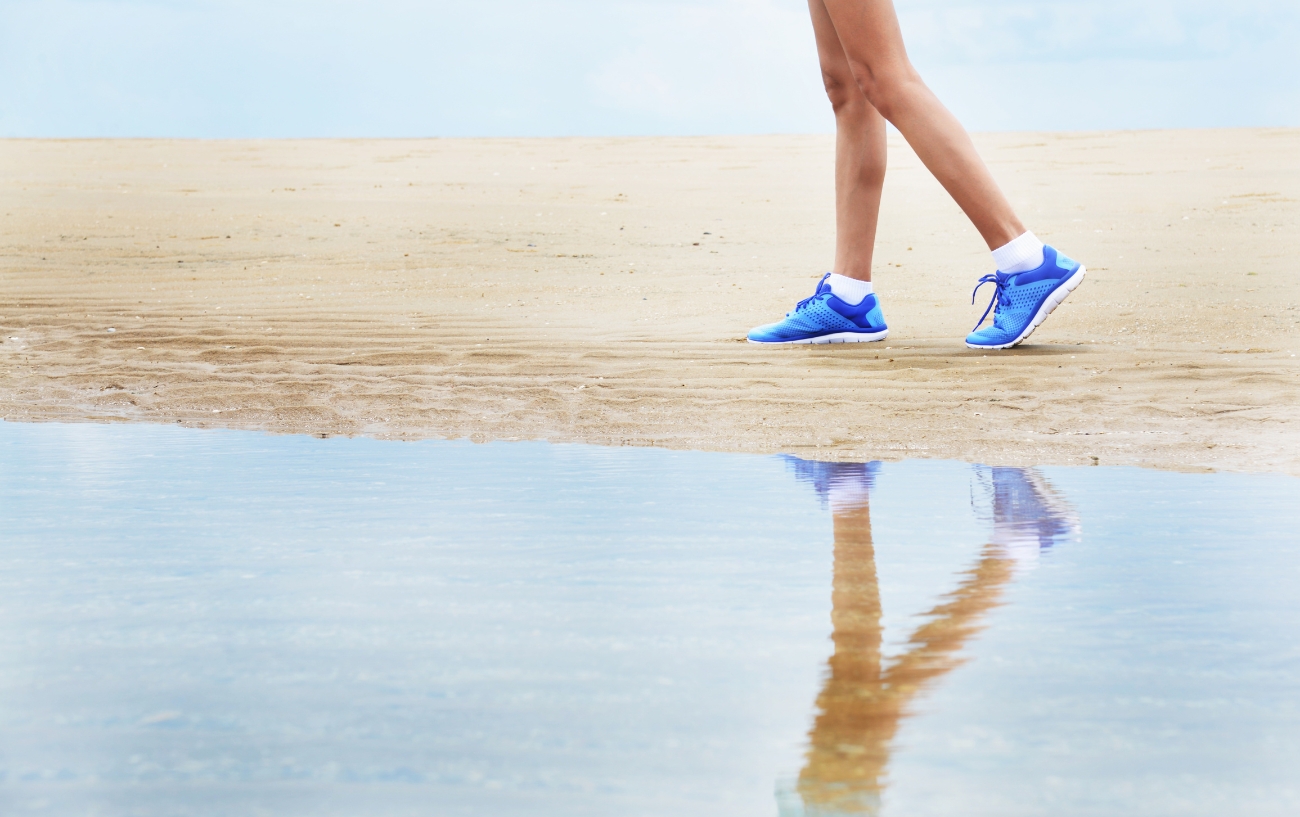 Woman walking on the beach