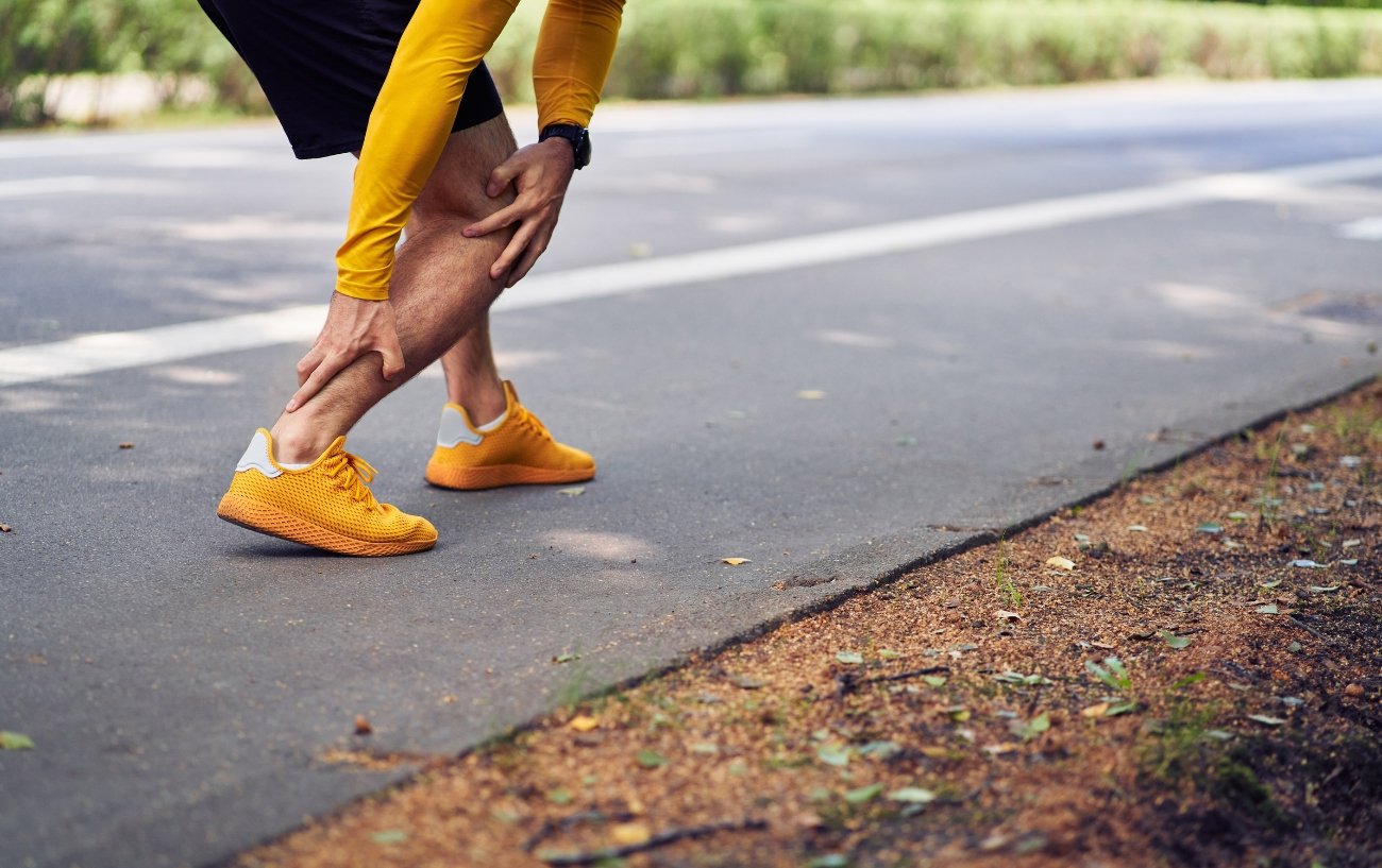 Runner experiencing  Achilles Tendonitis