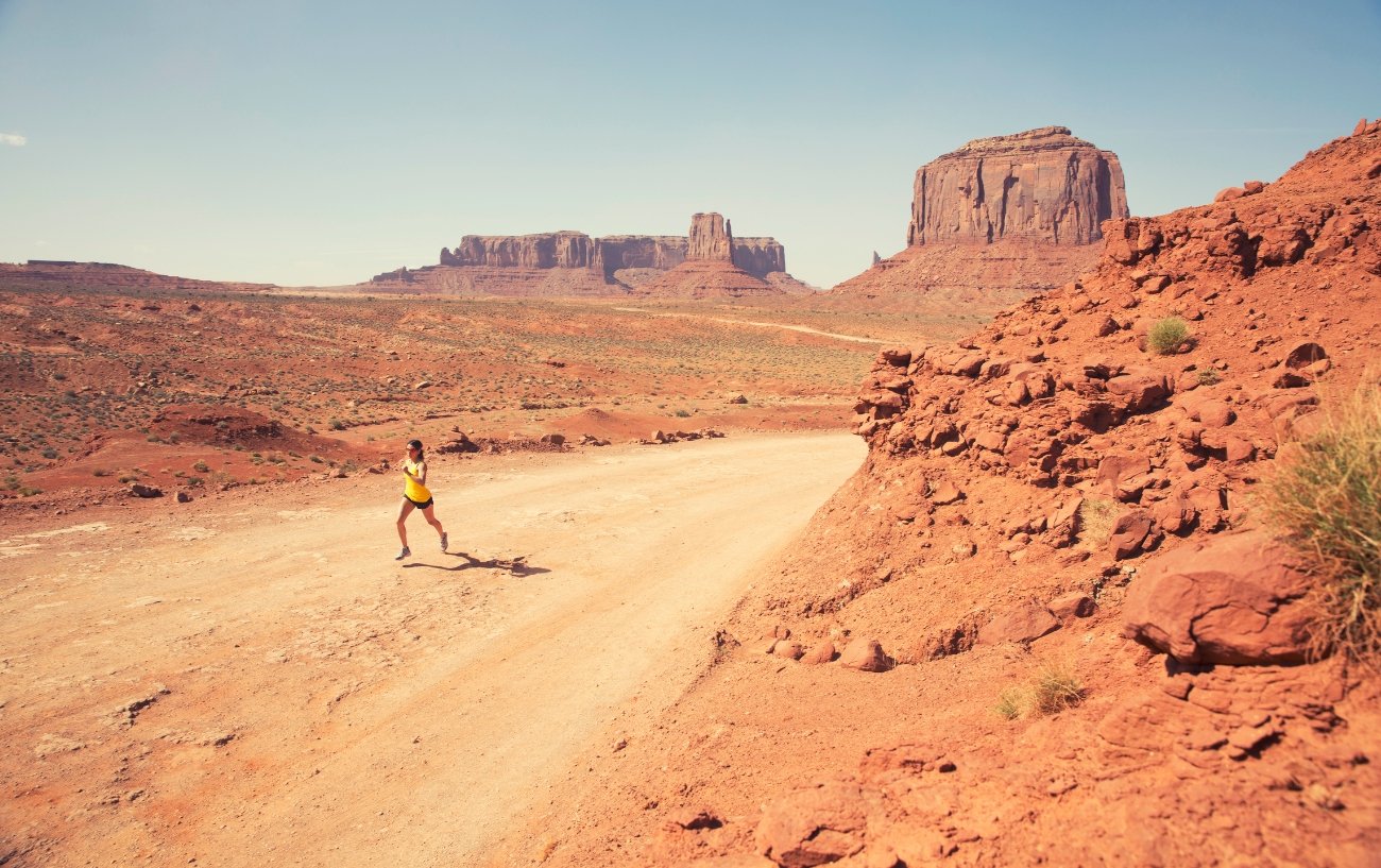 woman running ultra in desert