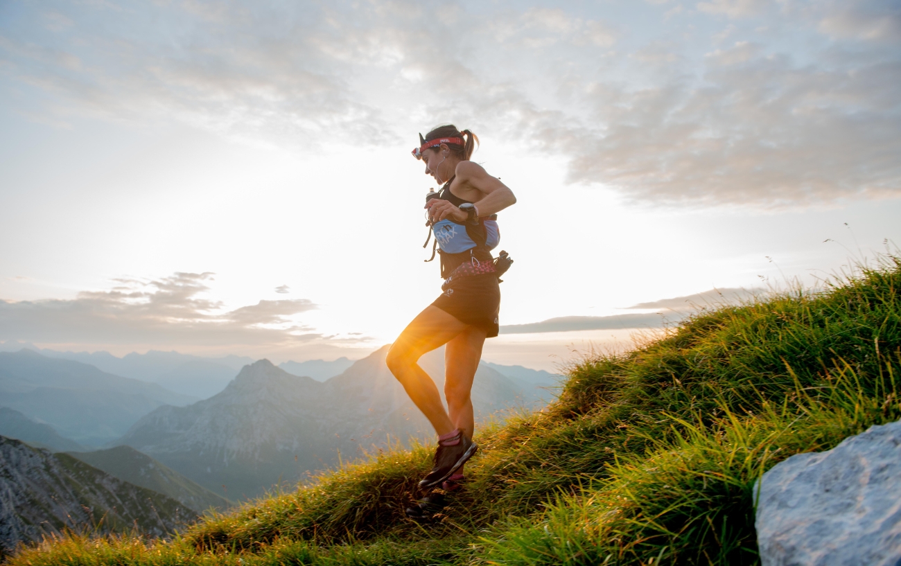 woman running ultra in mountains