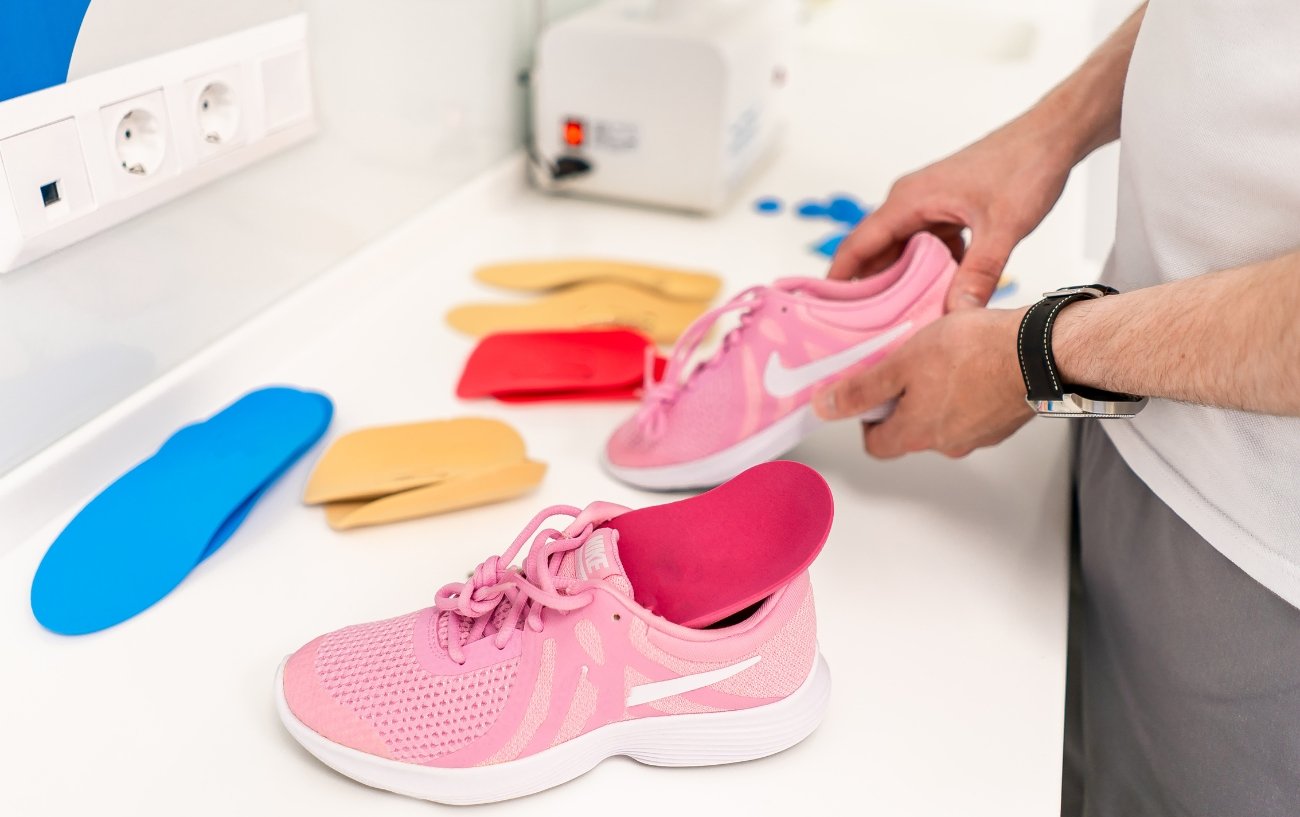 person testing arch support shoes