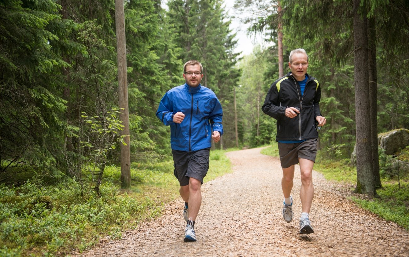 two men running in shorts