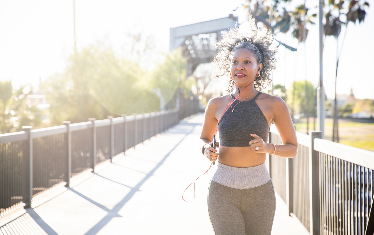 Woman with headphones running