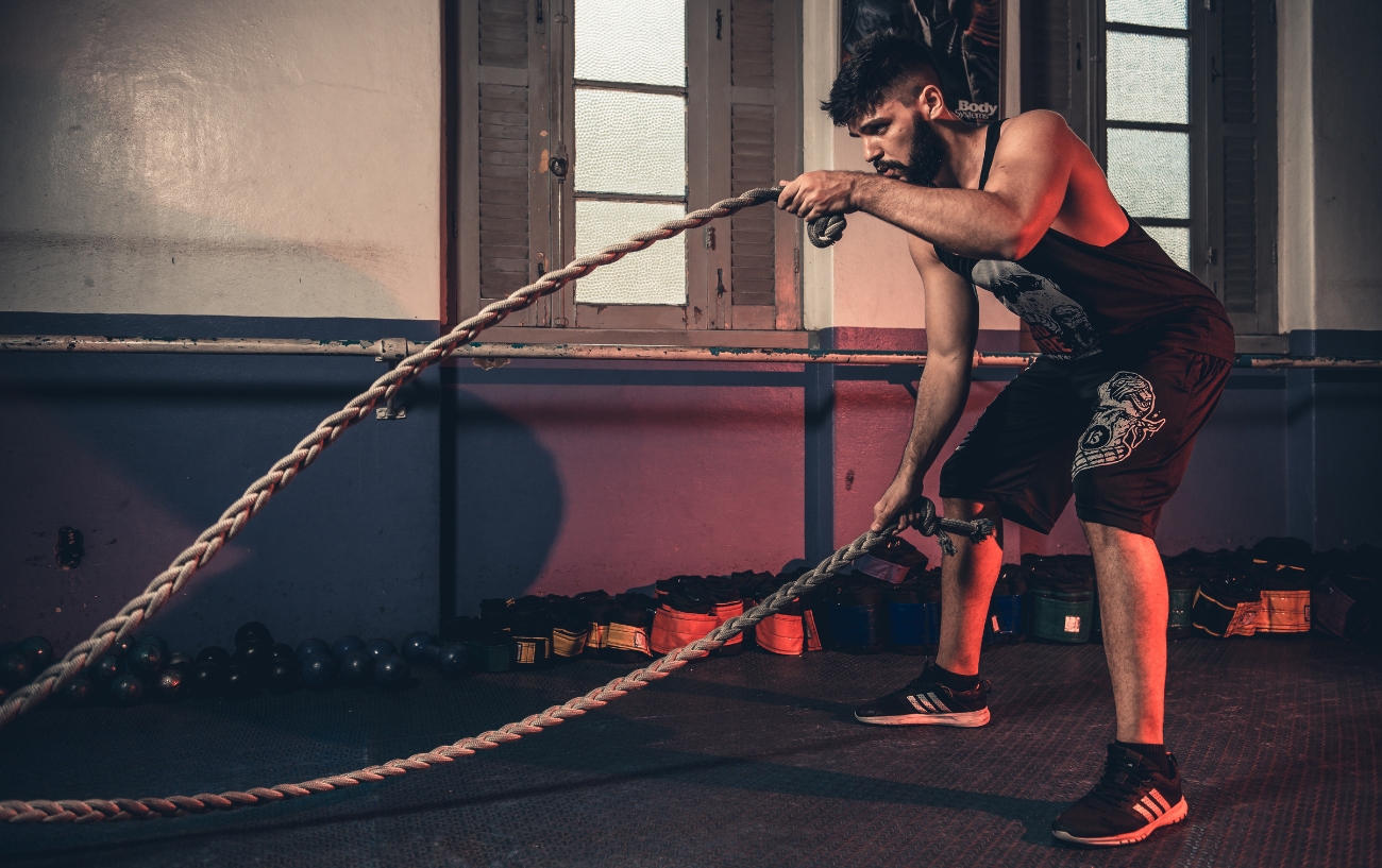 man excercising with rope