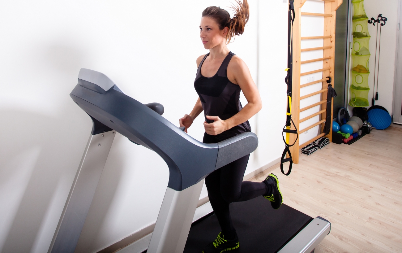 woman running on treadmill